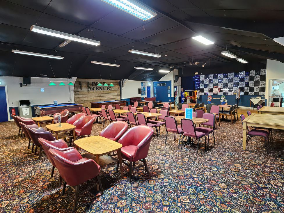 A bar area with tables and chairs at Watersmeet - 85 @ Park Avenue Holiday Village Leysdown-On-Sea, Kent
