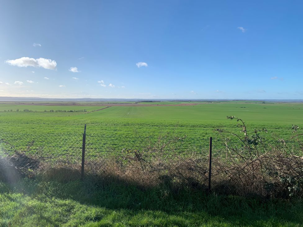 A wide field view with a fence and clear sky at Watersmeet - 85 @ Park Avenue Holiday Village Leysdown-On-Sea, Kent