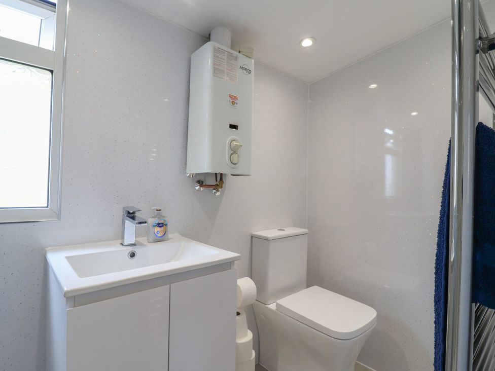 A bathroom featuring a sink and a toilet at Watersmeet - 85 @ Park Avenue Holiday Village, Leysdown-On-Sea, Kent