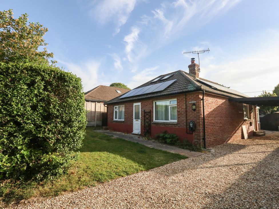 A house with solar panels and a garden at 2 North Road, Maiden Newton, Dorset