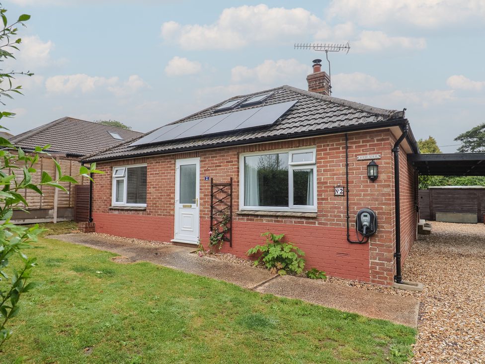 A front view of a bungalow with solar panels at 2 North Road, Maiden Newton, Dorset