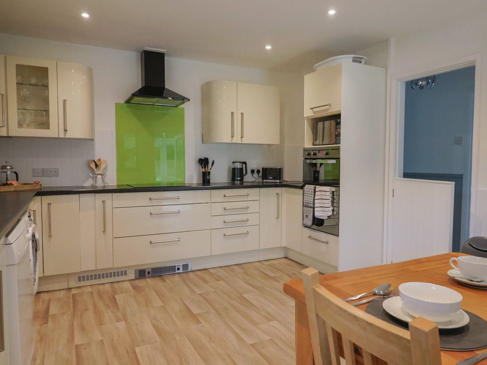 A kitchen with cabinets and appliances at 2 North Road Maiden Newton, Dorset