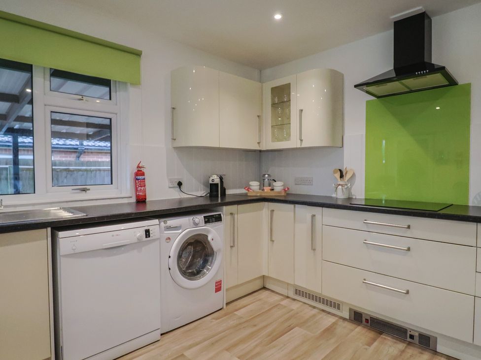 A kitchen with appliances and countertop at 2 North Road, Maiden Newton, Dorset