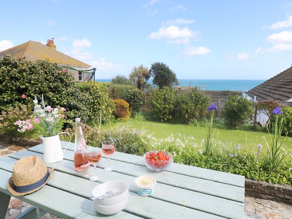 A garden table with drinks and snacks at Wootton Gray in Penzance