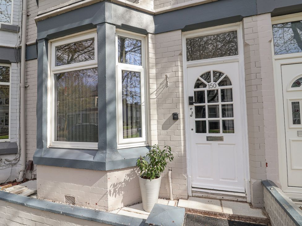 An entrance with a door and window at Ince Lodge in Liverpool