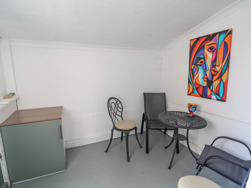 A snug with a table and chairs at Ince Lodge Liverpool