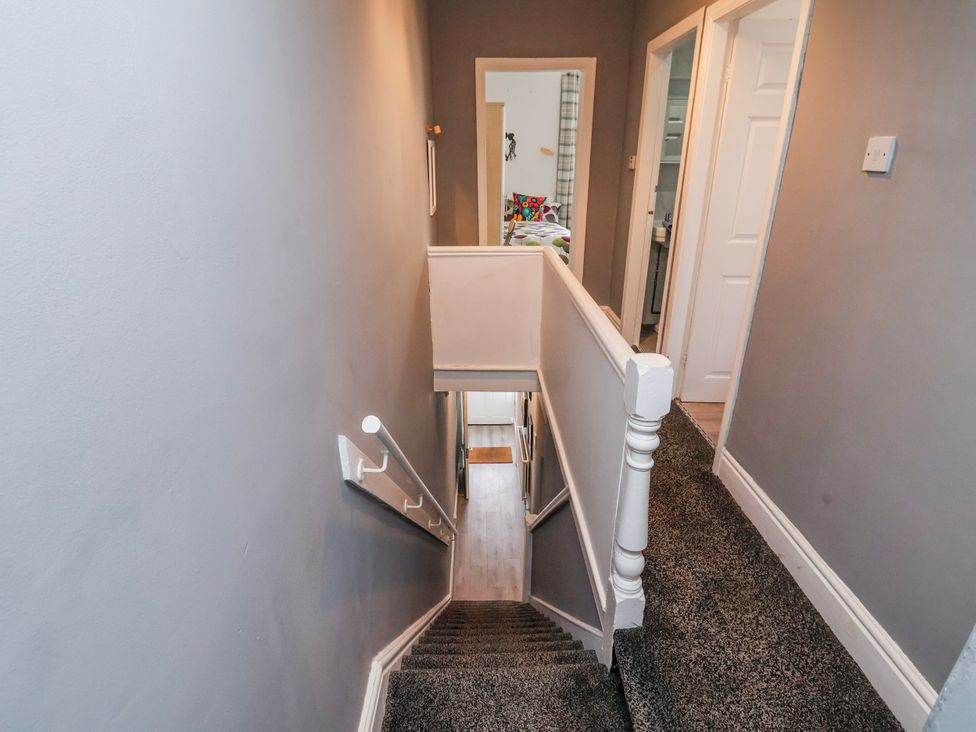 A staircase leading to a hallway at Ince Lodge in Liverpool