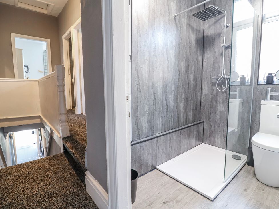 A bathroom with a shower and toilet at Ince Lodge Liverpool