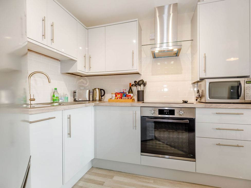 A kitchen with cabinets and appliances at Rails End