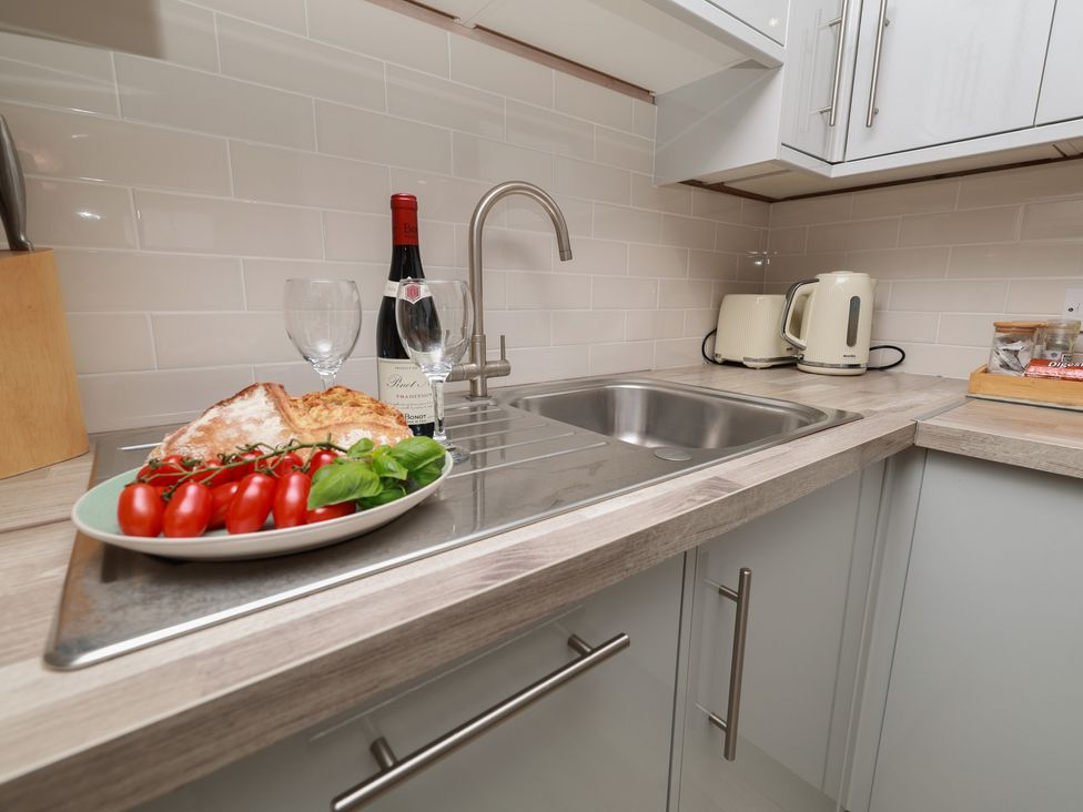 A kitchen with a sink and kitchen countertop at Rails End in Whitby