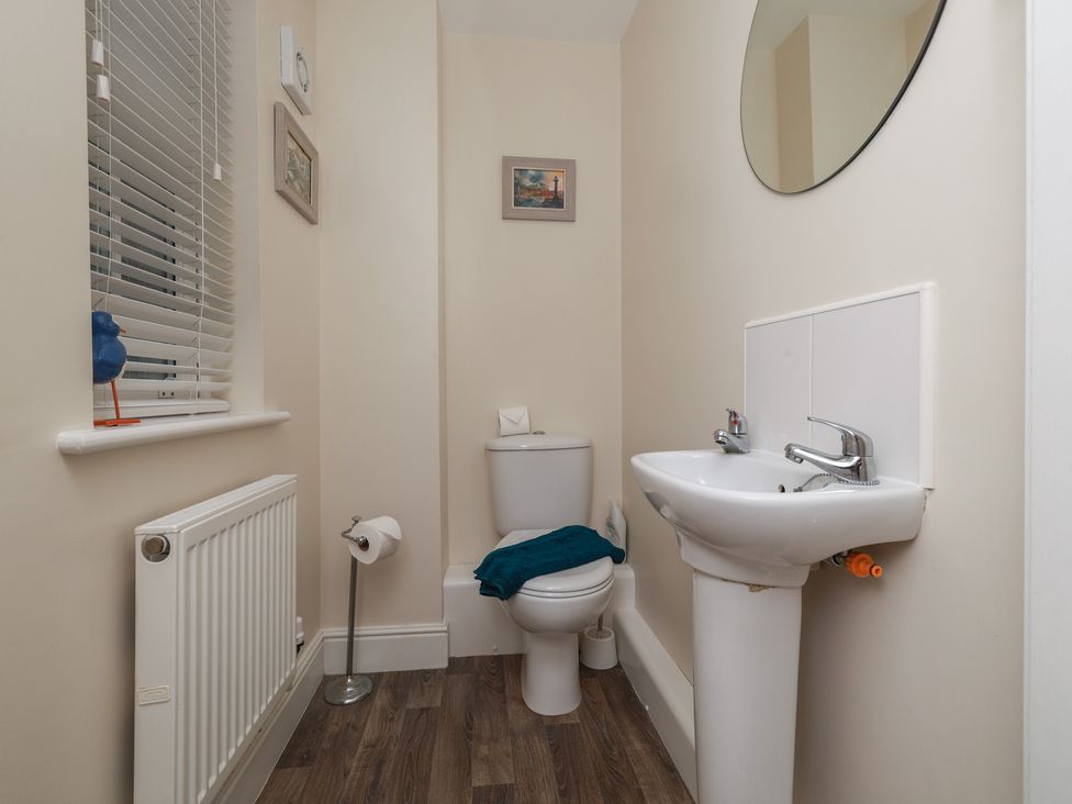 A bathroom with a sink and toilet at Rails End in Whitby