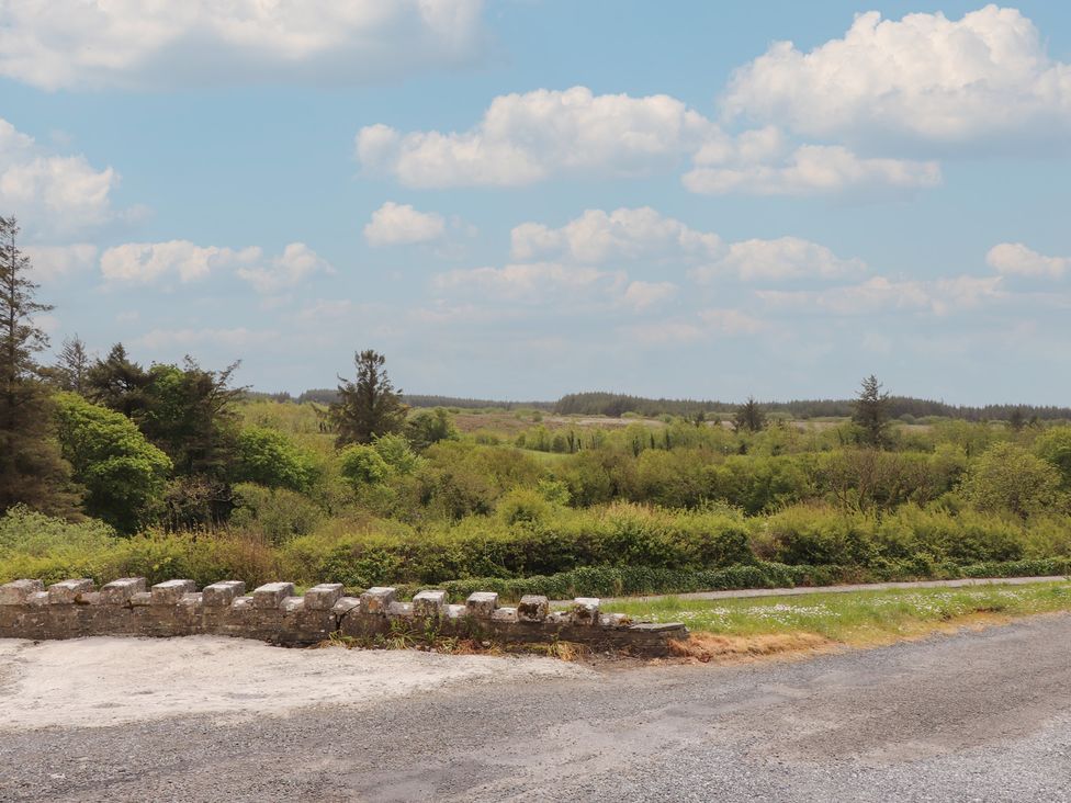 A view of trees and fields with a stone wall at 17 ROOSKA, Lisdoonvarna, County Clare