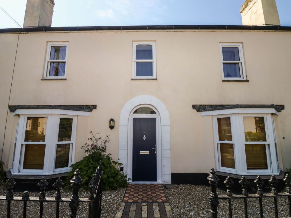 A house with a front door and windows at Flat 1 Kingsteignton