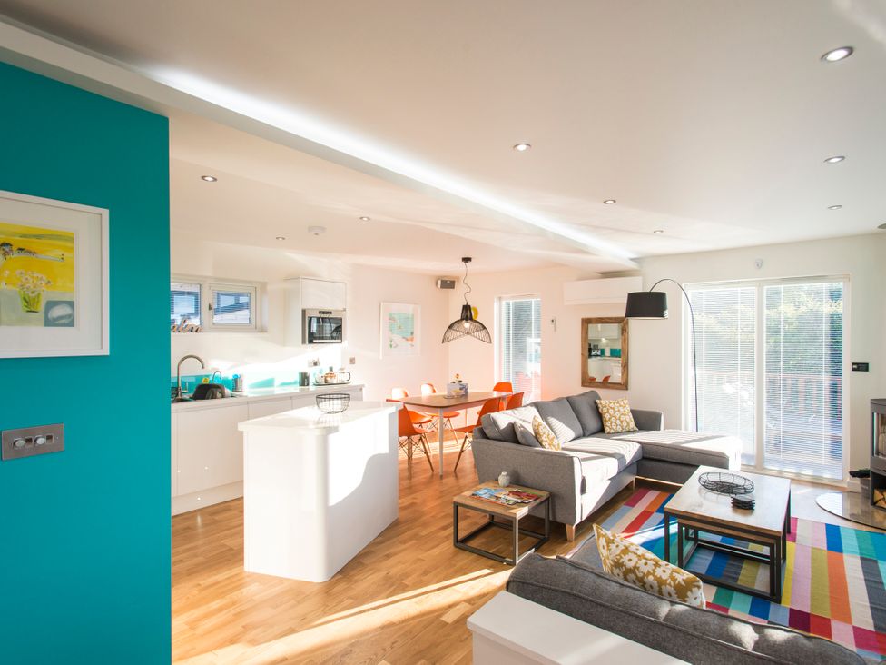 A living room with a sofa and coffee table at Barbara in Portreath