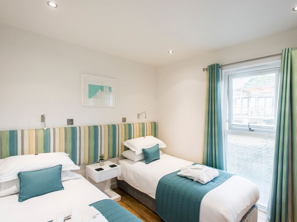 A bedroom with two beds and a window at Barbara in Portreath