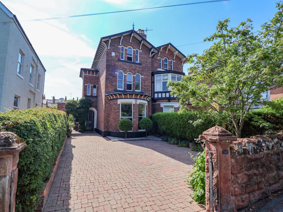 A house with a driveway and hedge at 34 Eaton Road in Chester