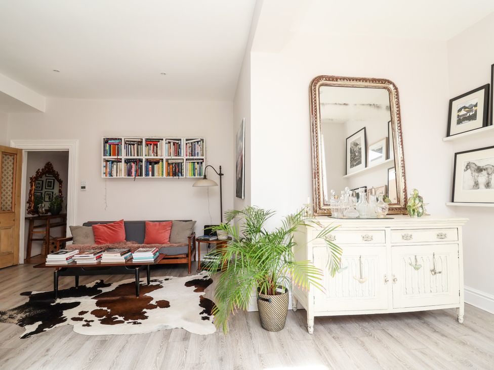 A living room with a sofa and bookshelf at 34 Eaton Road in Chester