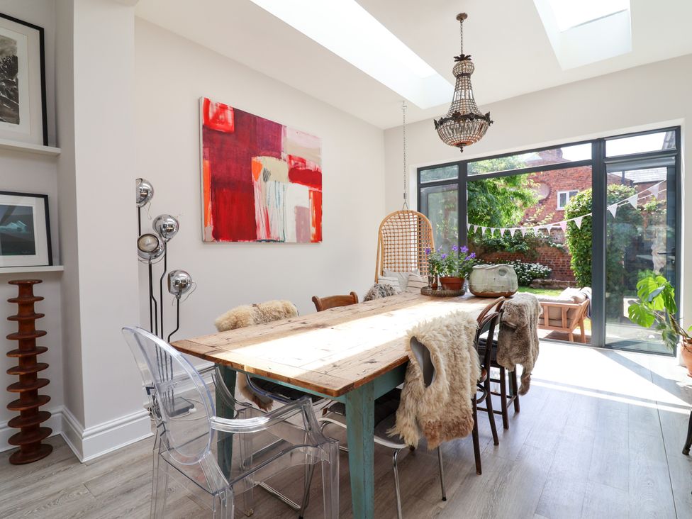 A dining room with a table and chairs at 34 Eaton Road Chester