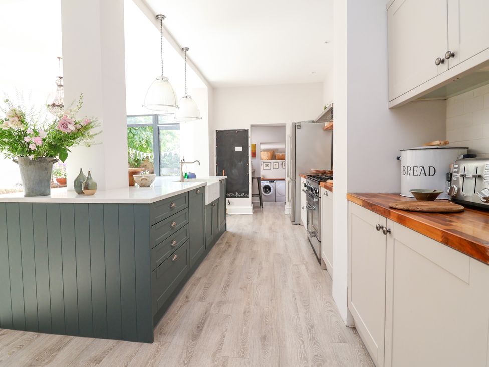 A kitchen with an island and appliances at 34 Eaton Road Chester