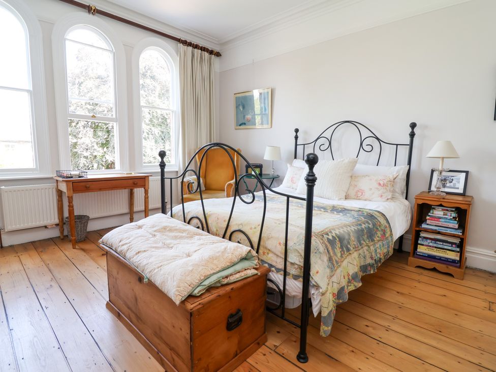 A bedroom with a bed and wooden chest at 34 Eaton Road in Chester