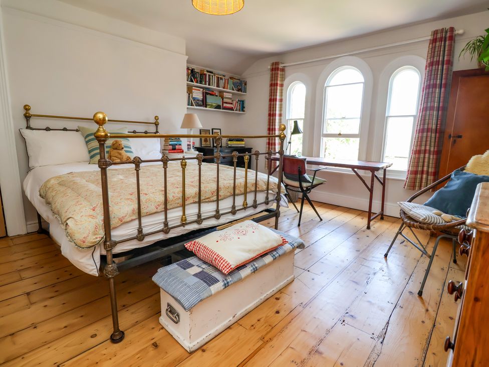 A bedroom with a bed and bookshelf at 34 Eaton Road in Chester