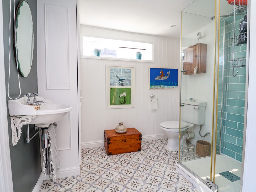 A bathroom with a sink, toilet, and shower at 34 Eaton Road, Chester
