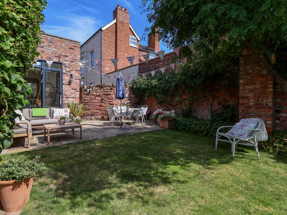 A garden with seating area and plants at 34 Eaton Road Chester