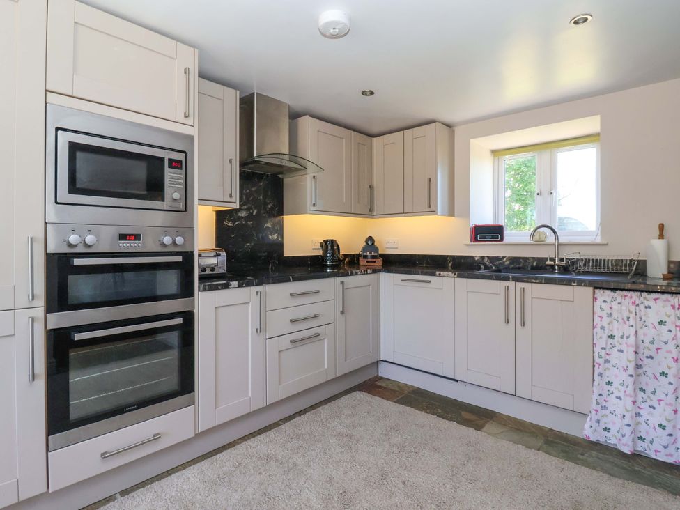 A kitchen with cabinets and countertop at The Annexe at Dalby Carr