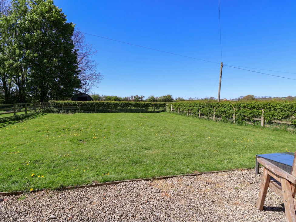An outdoor space with grass and trees at The Annexe at Dalby Carr