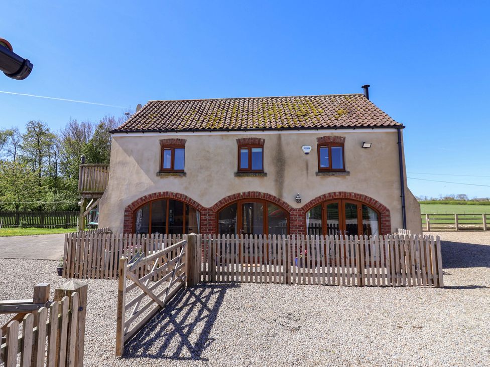 A house with windows and a fence at The Annexe at Dalby Carr