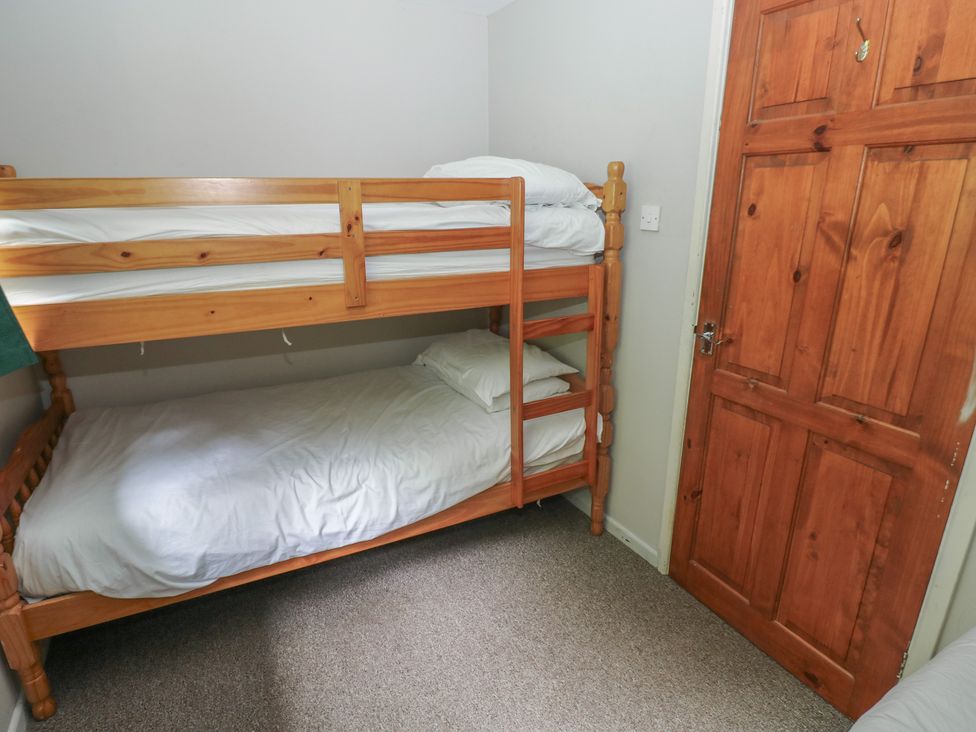 A bunk bed in a bedroom at Cabin No. 11 - Salt and Fern Cabins Goytre near Port Talbot