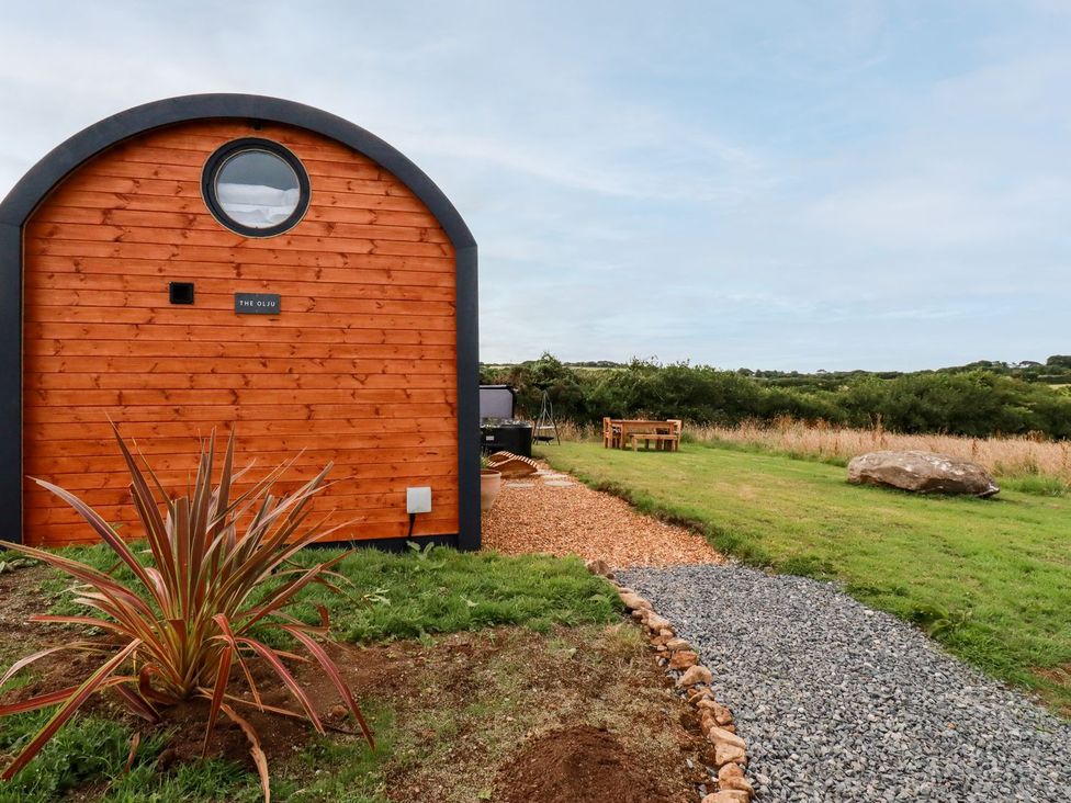 An outdoor view of a building with a garden at The Olju in Truro