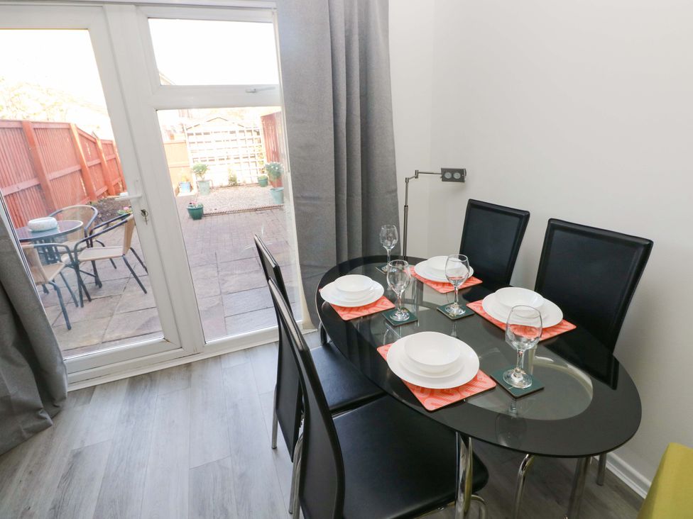 A dining room with a table and chairs at The Gower Gateway in Gowerton near Swansea
