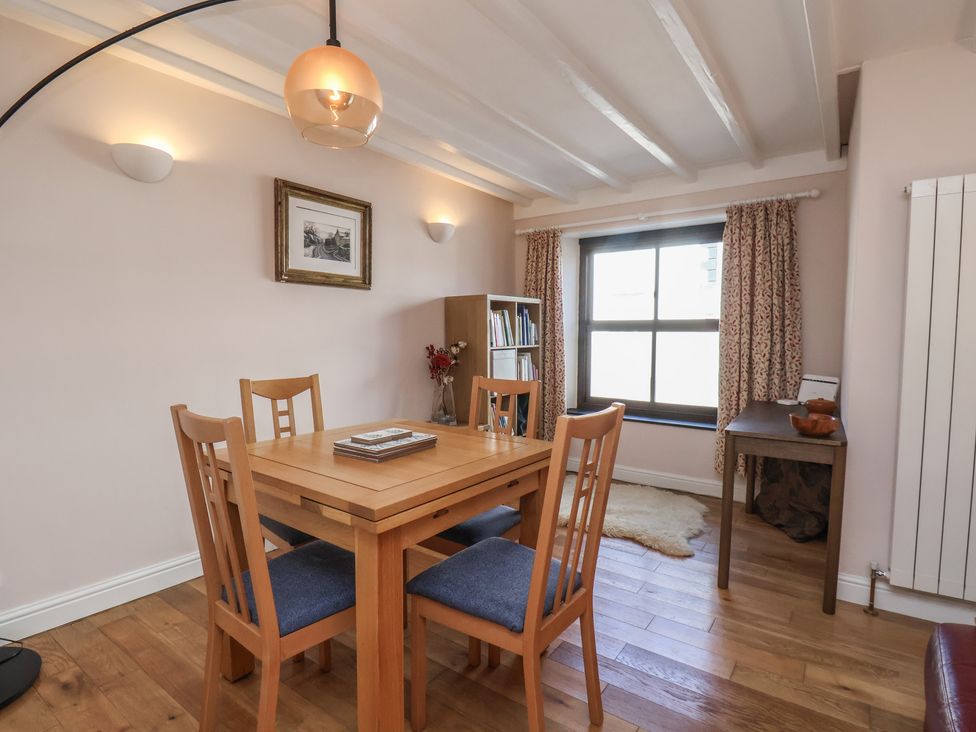 A dining room with a table and chairs at Fleming Cottage