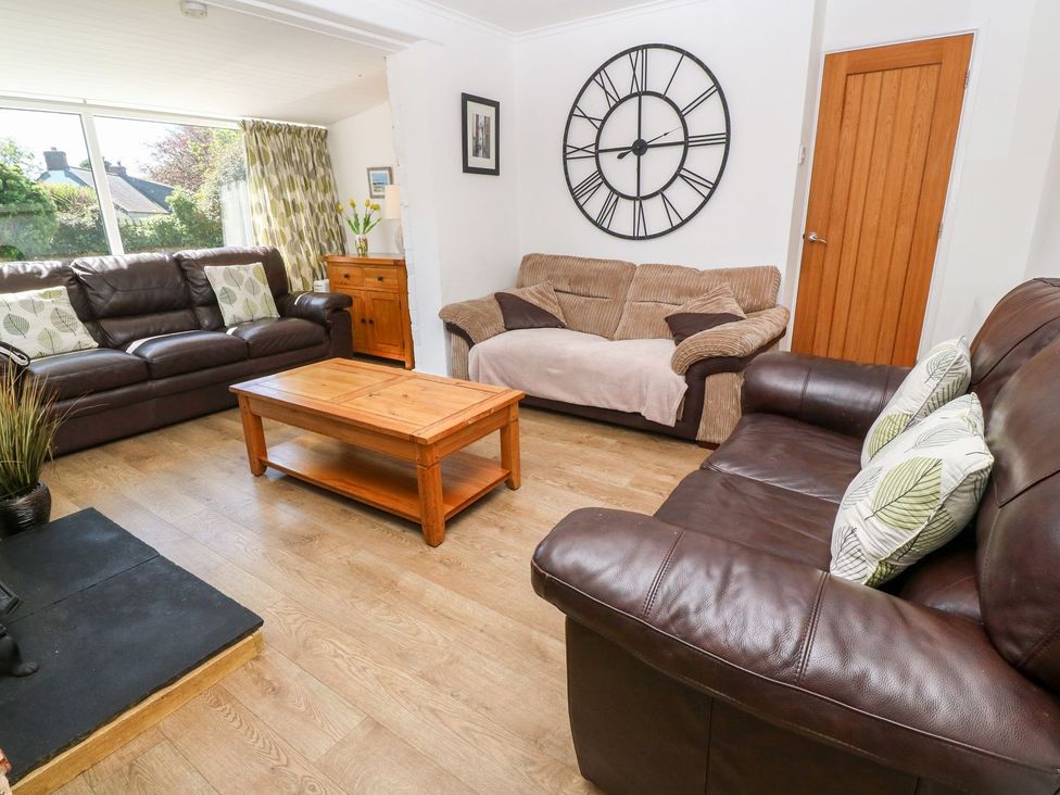 A living room with a sofa and coffee table at Tinners Way in Helston