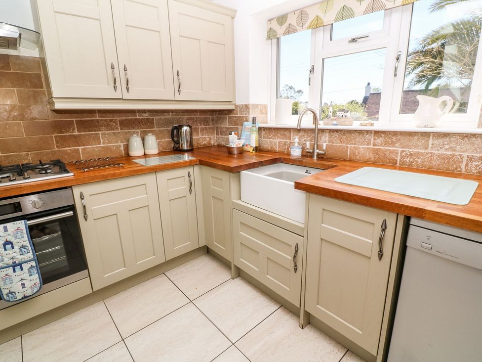 A kitchen with cabinets and a sink at Tinners Way in Helston