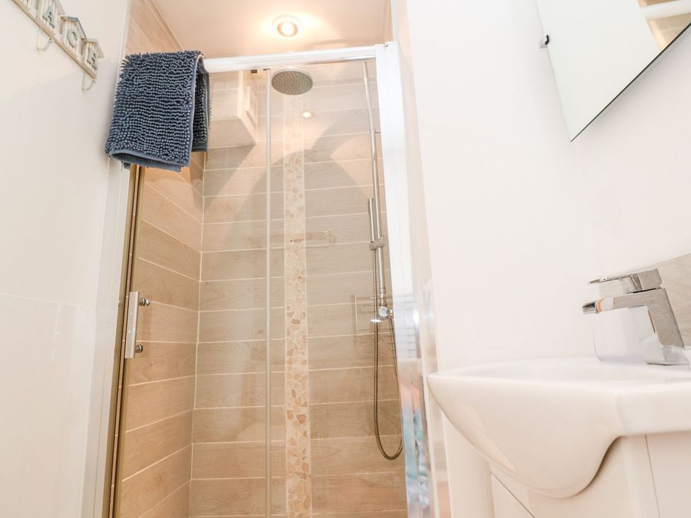 A bathroom with a shower and sink at Tinners Way Helston