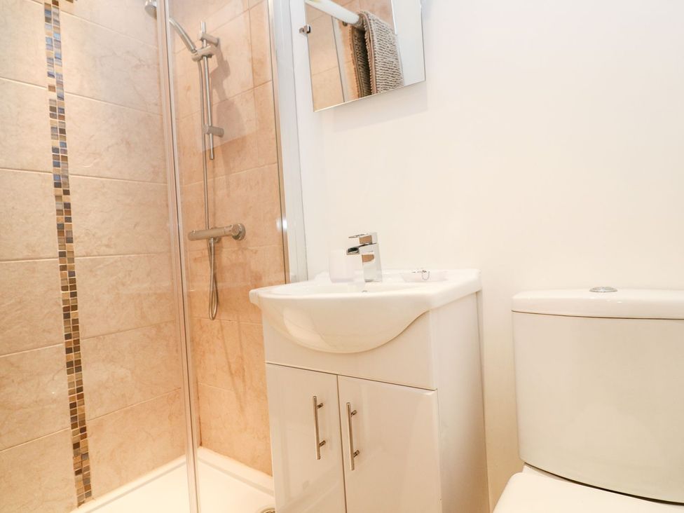 A bathroom with a shower and a sink at Tinners Way in Helston