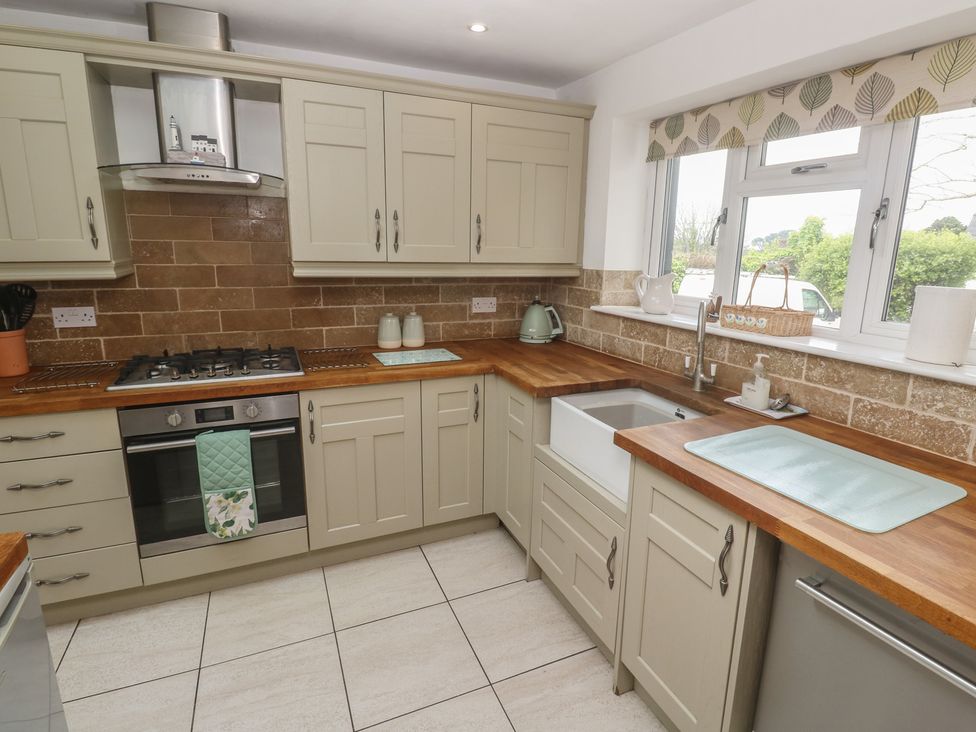 A kitchen with a gas stove and sink at Tinners Way in Tresowes near Ashton