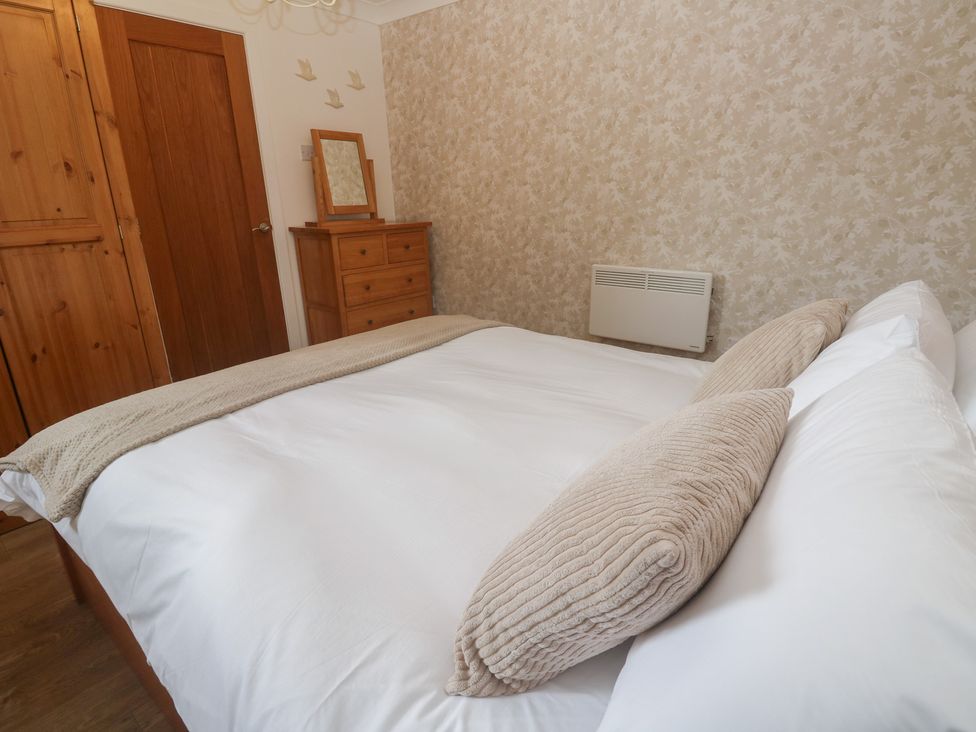 A bedroom with a bed and furniture at Tinners Way in Tresowes near Ashton