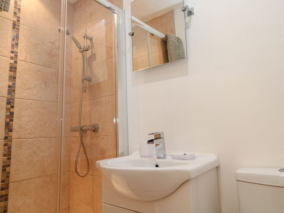 A bathroom with a shower and sink at Tinners Way in Tresowes near Ashton