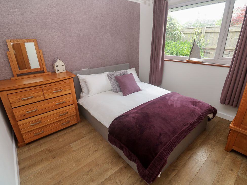 A bedroom with a bed and dresser at Tinners Way in Tresowes near Ashton
