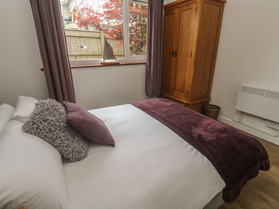 A bedroom with a bed and wardrobe at Tinners Way Tresowes near Ashton