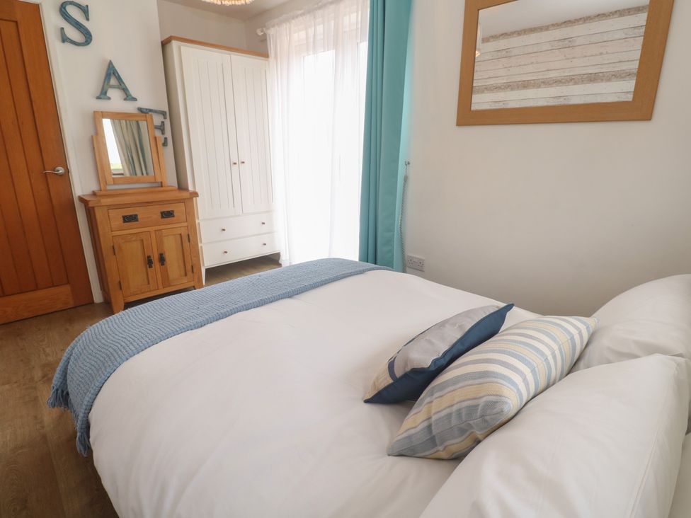 A bedroom with a bed and furniture at Tinners Way in Tresowes near Ashton