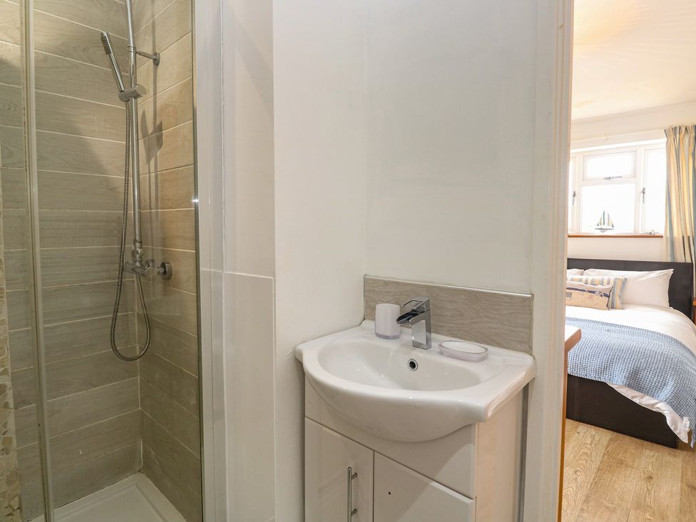 A bathroom showing a shower and sink at Tinners Way in Tresowes near Ashton