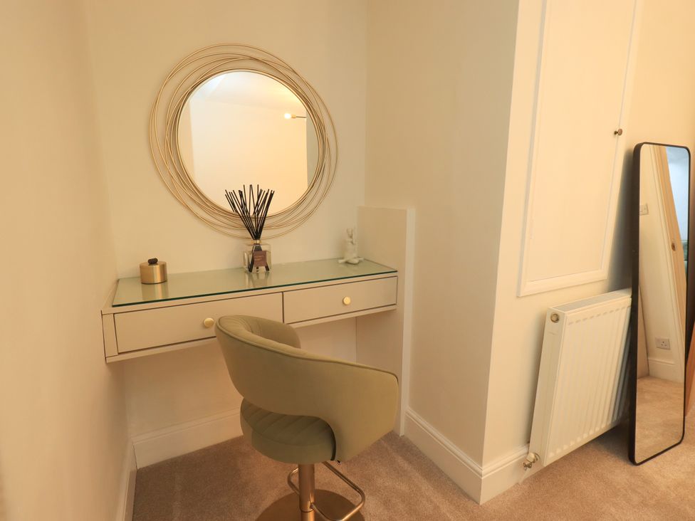 A dressing room with a vanity desk and chair at 7 Milnthorpe Road Holme near Burton-In-Kendal