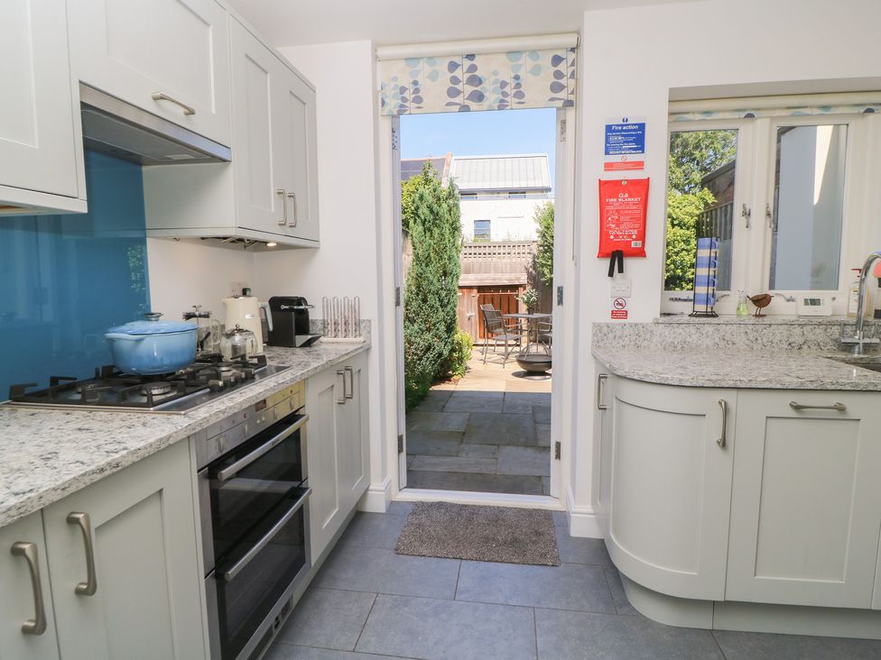 A kitchen with a stove and oven at Cobblers Cottage in Lymington
