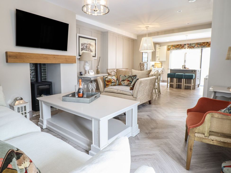 A living room with a coffee table and sofa at 2 Llewelyn Street in Conwy