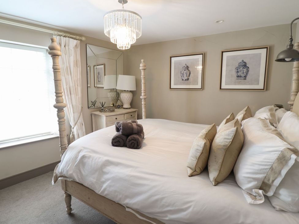 A bedroom with a bed and pillows at 2 Llewelyn Street Conwy