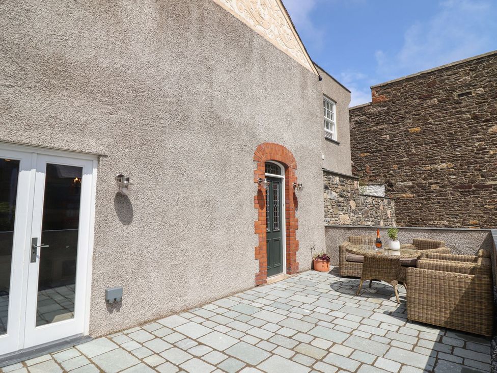 An outdoor patio with a table and chairs at 2 Llewelyn Street Conwy